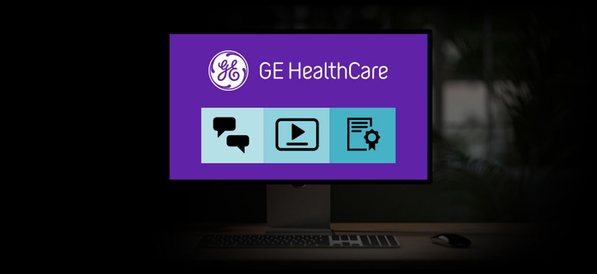 Header illustration of a computer monitor with the GE HealthCare logo on a desk.