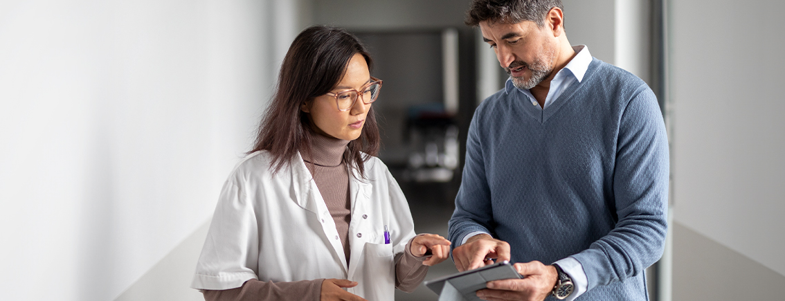 two general practitioners speaking over an iPad