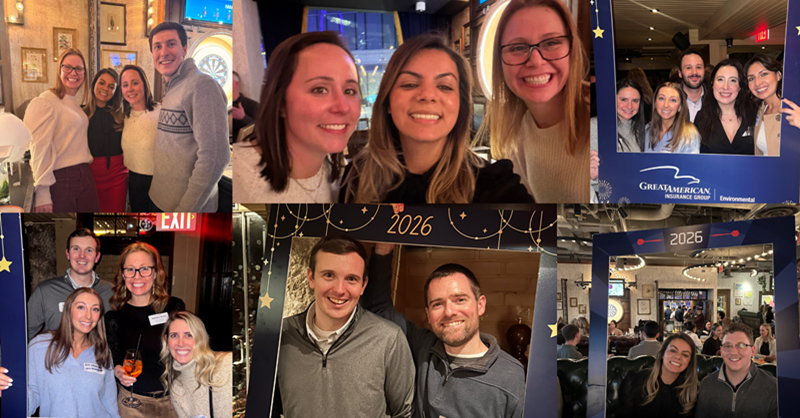 group of young professionals posing for picture