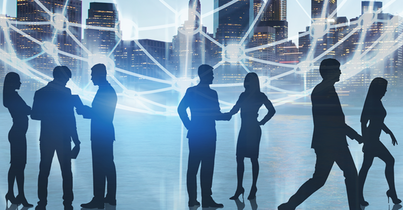 silhouette of people shaking hands