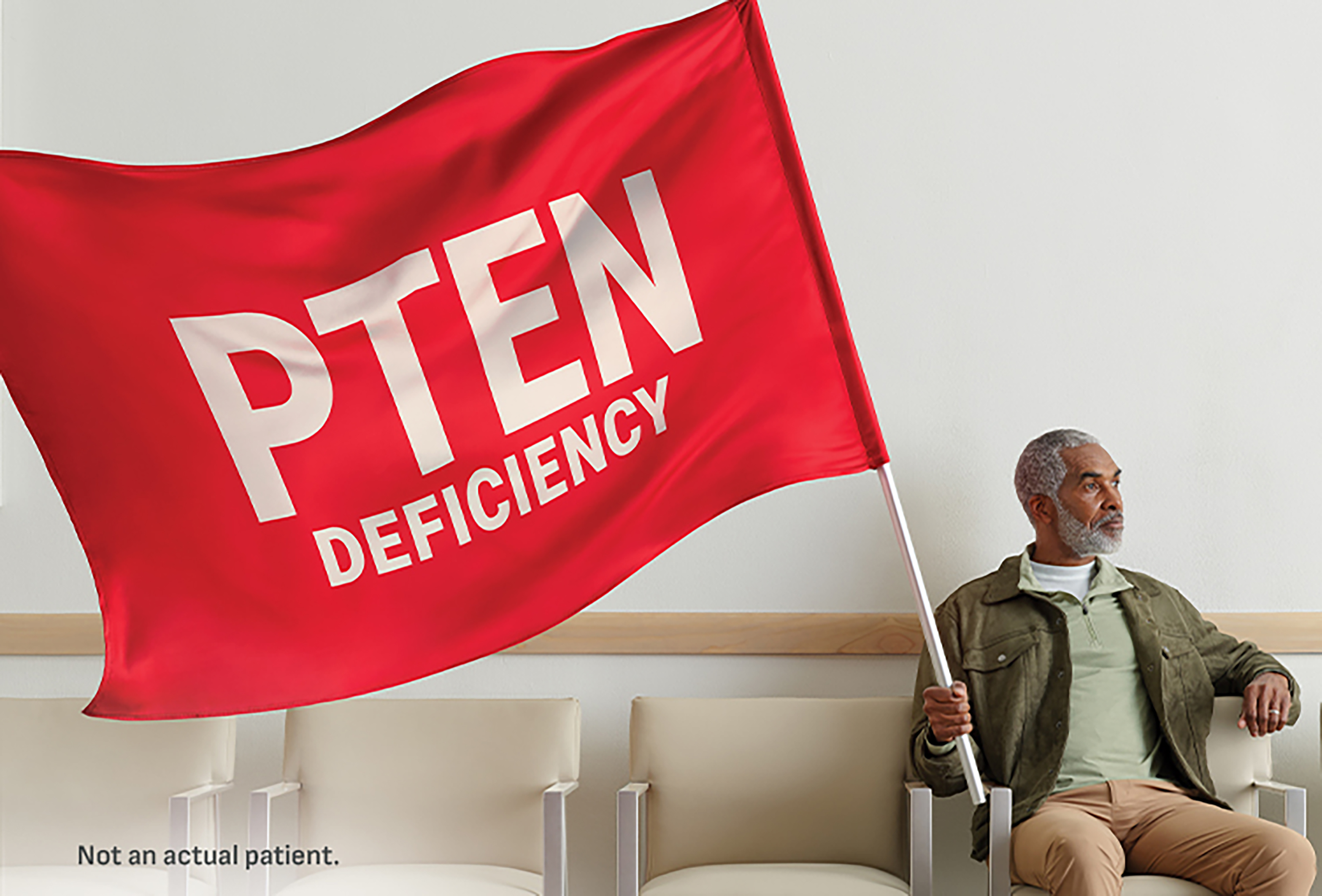 Person holding PTEN Deficiency red flag