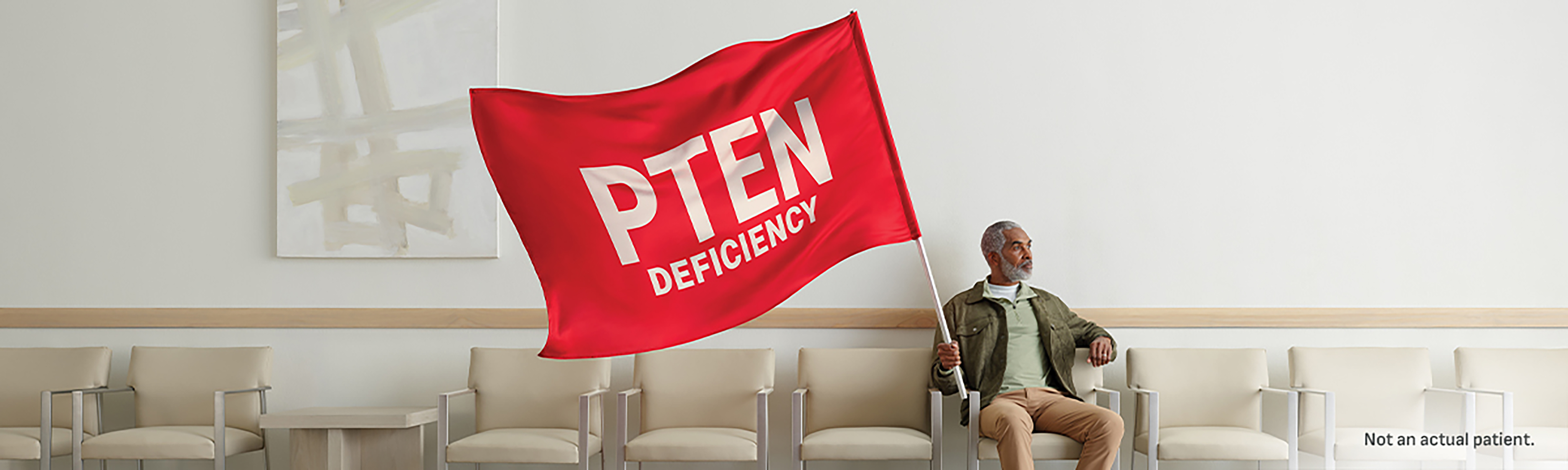 Person holding PTEN Deficiency red flag
