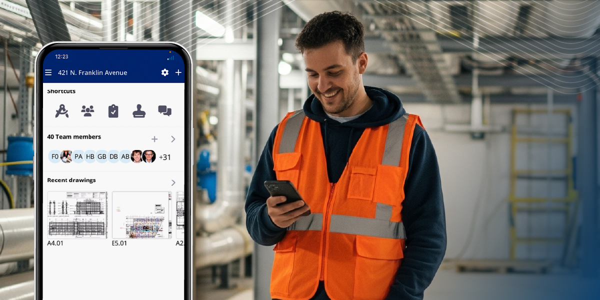 A man in an orange hi-vis vest is looking at his phone and smiling with an MEP environment in the background. On the left side of the image is a close-up of a phone screen showing the ProjectSight mobile interface.