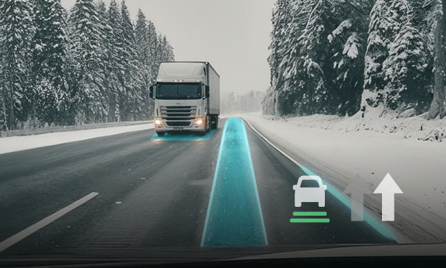 A white semi-truck drives on a snowy road through a forest with a digital blue lane highlight and autonomous driving icons.