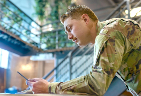 Two colleagues collaborate on a project, discussing ideas while looking at computer screen.