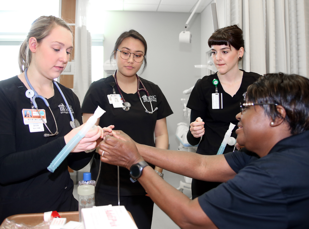 Students learning in a clinical setting.