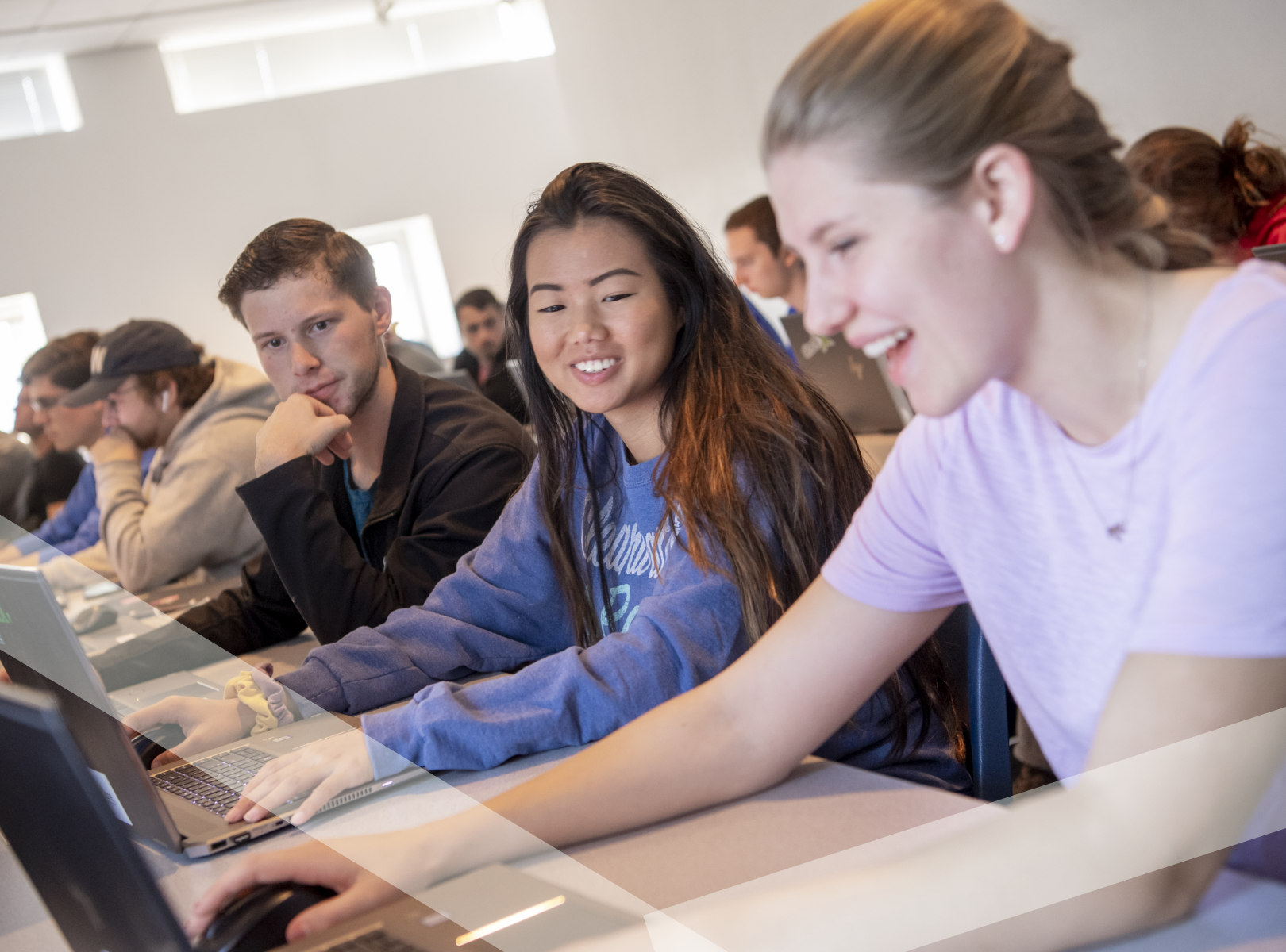 Students working on laptops.