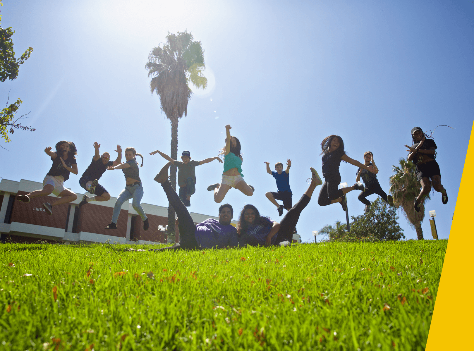 Students jumping and posing for a picture.