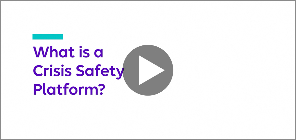 two people in corporate setting at desktop together