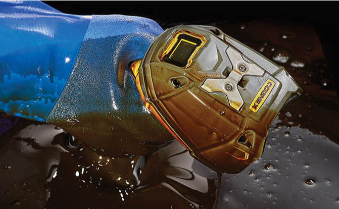 Cognex handheld reader covered in oil