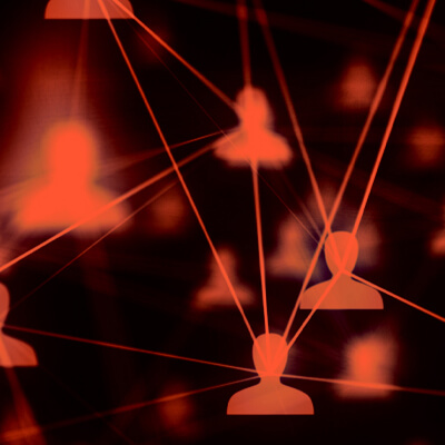 Abstract image of red person icons connected by glowing lines, representing a network.